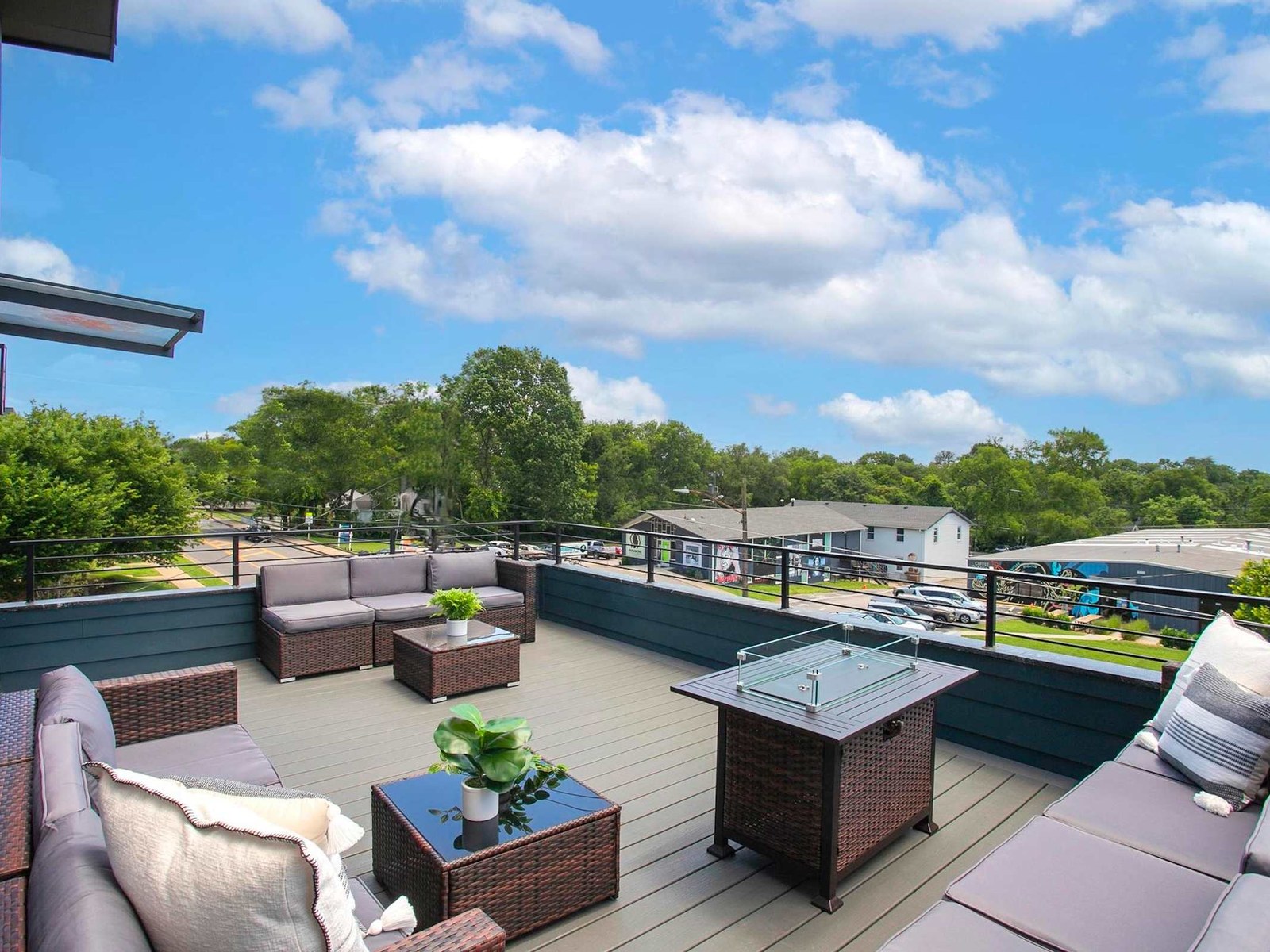 Nashville rooftop deck with outdoor seating and a fire pit